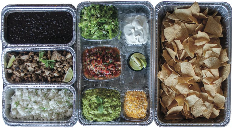 a plastic container filled with different types of food