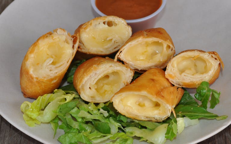 Crispy flour tortilla taquitos filled with cheese