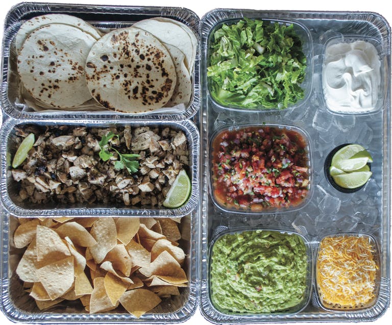 a plastic container filled with different types of food